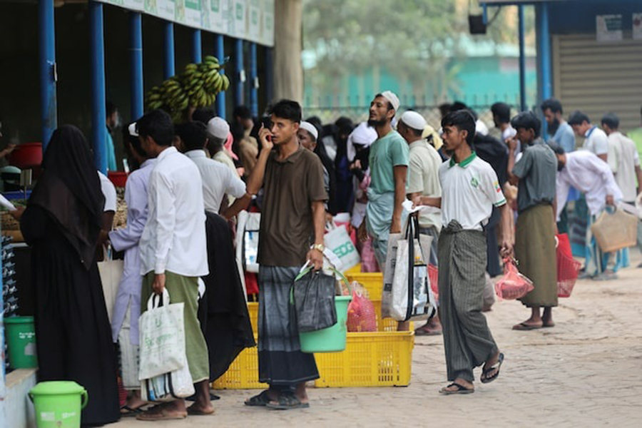 Rohingya refugees stand in queue to receive ration from the World Food Program(WFP), at a refugee camp in Cox's Bazar, Bangladesh, on April 18, 2026 — Reuters photo