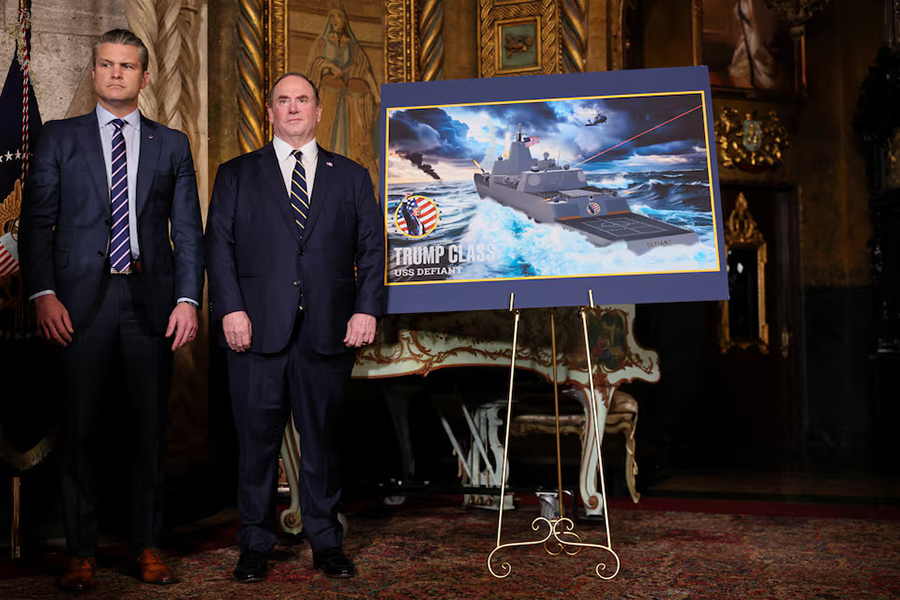 US Secretary of Defense Pete Hegseth and Secretary of the Navy John Phelan stand by a rendering of the 'Trump Class' USS Defiant, as they listen to President Donald Trump (not pictured) make an announcement about the Navy's "Golden Fleet", at Mar-a-lago in Palm Beach, Florida, US on December 22, 2025 — Reuters/File
