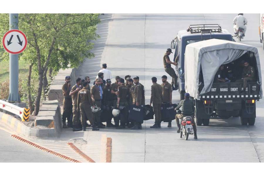 Police officers arrive on a road, following the suspension of transport and closure of markets on security restrictions, as Pakistan prepares to host US and Iran for the second phase of peace talks in Islamabad, Pakistan, Apr 24, 2026.