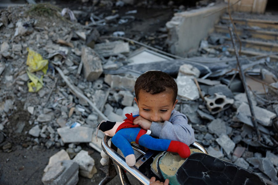 A child plays among the rubble of a building damaged by an Israeli strike, amid a temporary ceasefire between Lebanon and Israel, in Housh near Tyre, Lebanon, April 23, 2026.