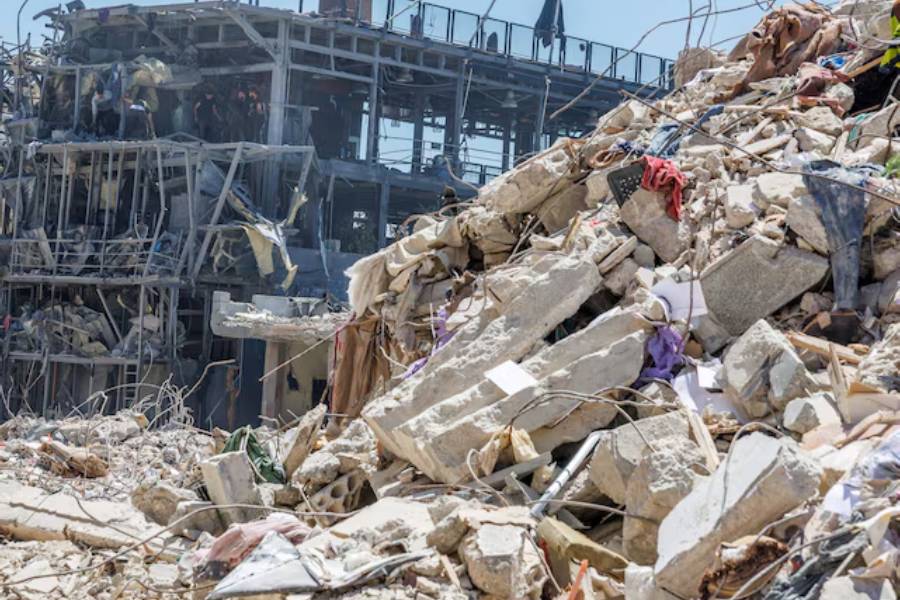 Workers clean a restaurant that was damaged by an Israeli strike, amid a temporary ceasefire between Lebanon and Israel, in Tyre, Lebanon, April 23, 2026.