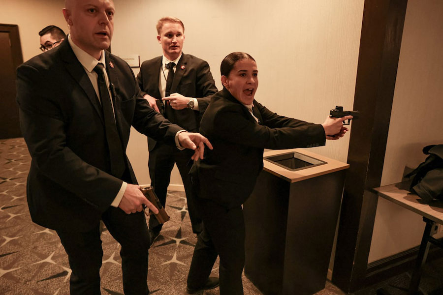 Security officials react as a shooter opens fire during the annual White House Correspondents' Association dinner in Washington, DC, US, April 25, 2026.