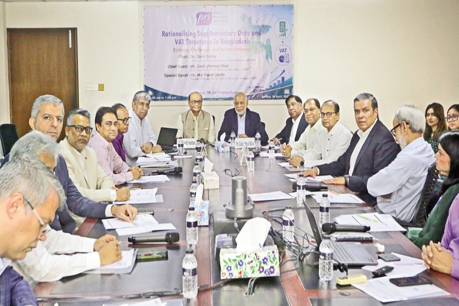 Guests and participants pose for a photograph at a policy dialogue organised by the Policy Research Institute of Bangladesh (PRI) at the PRI conference room in the capital on Sunday. The event was chaired by PRI Chairman Dr Zaidi Sattar, while Palli Karma Sahayak Foundation Chairman Md Zakir Ahmed Khan attended as the chief guest. — FE photo