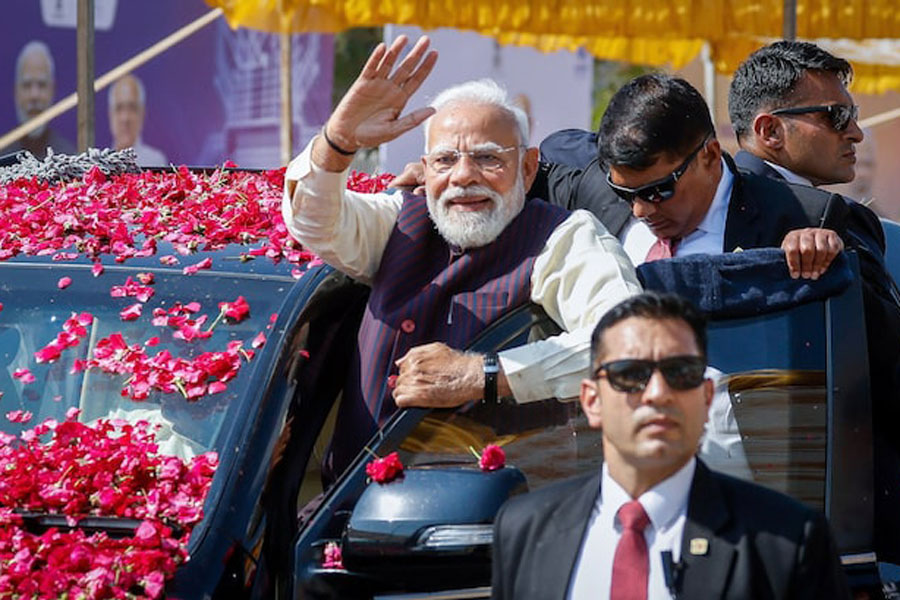 India's Prime Minister Narendra Modi waves to the crowd as he arrives to inaugurate Micron Technology's semiconductor assembly and testing plant in Sanand, Gujarat, India, February 28, 2026.