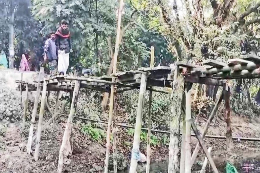 A partial view of a dilapidated wooden bridge between Koya and Koroiyya villages in Kachua upazila-FE Photo