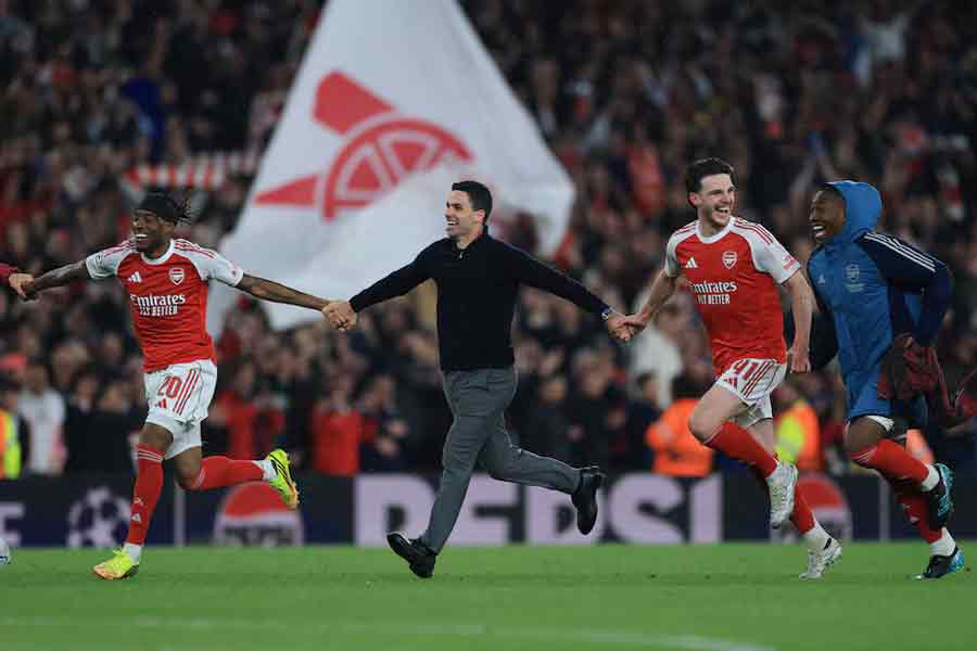 Arsenal's Noni Madueke, manager Mikel Arteta, Declan Rice and Eberechi Eze celebrate after reaching the UEFA Champions League final on Wednesday. — Reuters photo