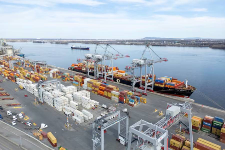 A drone view shows shipping containers and transport trucks at the Port of Montreal in Montreal, Quebec, Canada April 14, 2025.