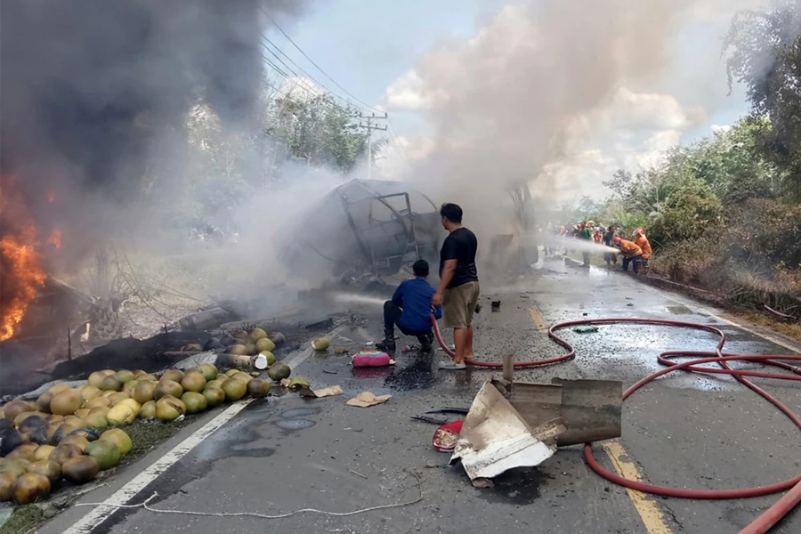 Rescuers try to extinguish a fire after a passenger bus collided with a fuel truck in Musi Rawas, South Sumatra, Indonesia on Wednesday, May 6, 2026 — AP photo