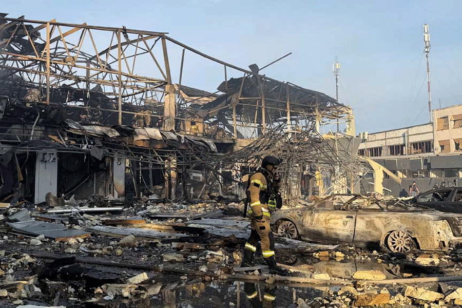 Rescuers work at a site of a Russian air strike, amid Russia's attack on Ukraine, in Zaporizhzhia, Ukraine May 5, 2026. Picture taken with a mobile phone.