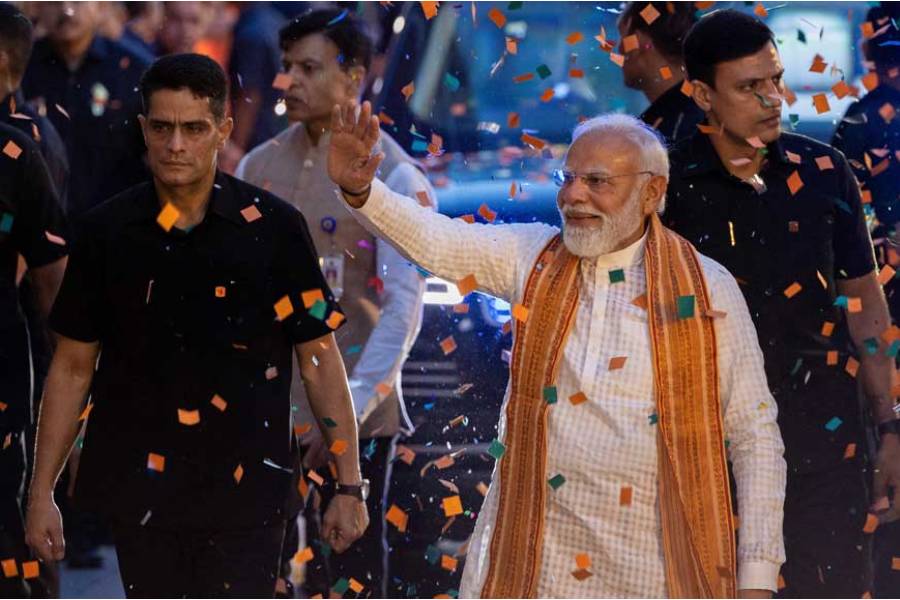 India's Prime Minister Narendra Modi greets his supporters as he arrives at the Bharatiya Janata Party (BJP) headquarters as BJP celebrates its win in the West Bengal and Assam states' assembly elections, in New Delhi, India, May 4, 2026.