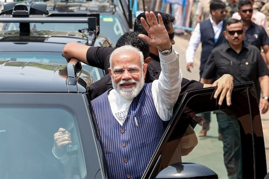 Indian Prime Minister Narendra Modi waves during a roadshow in Kolkata's Dum Dum last month — PTI/File