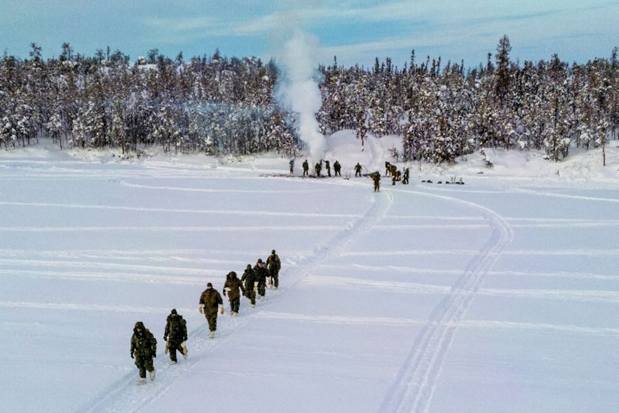 A drone view shows members of 41 Canadian Brigade Group, as part of Task Force Grizzly, carrying their gear back to their arctic tents as Canadian Armed Forces deploy to "Operation Nanook-Nunalivut," an annual series of drills designed to highlight the military's ability to defend the Canadian Arctic, in Yellowknife, Northwest Territories, Canada February 15, 2026.