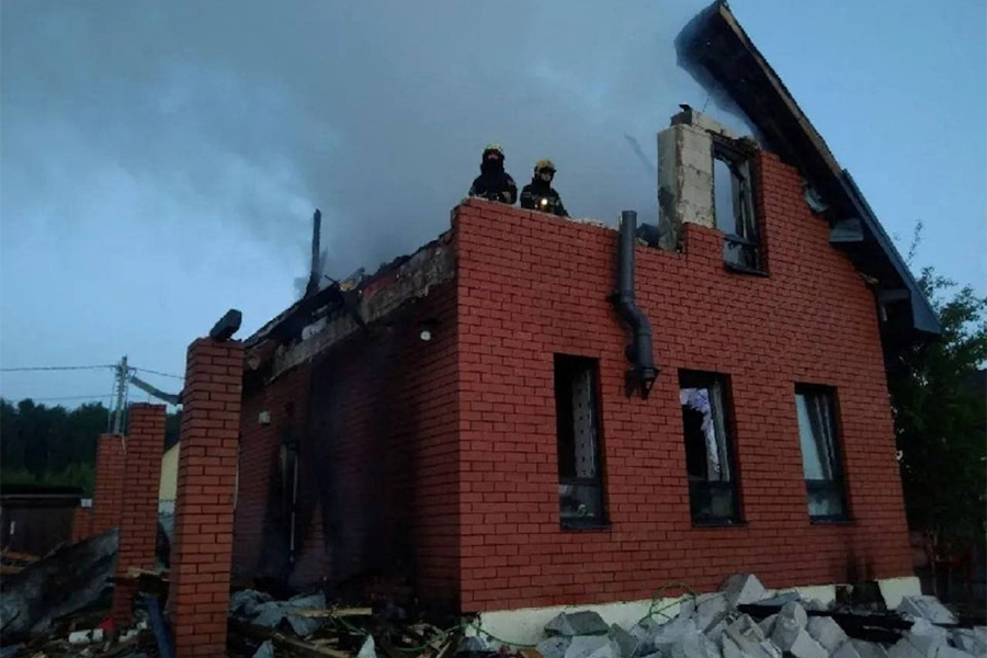 Firefighters work at a damaged house after a Ukrainian drone attack in the Moscow region, Russia on May 17, 2026 — Moscow Regional Governor Andrei Vorobyov/Handout via REUTERS