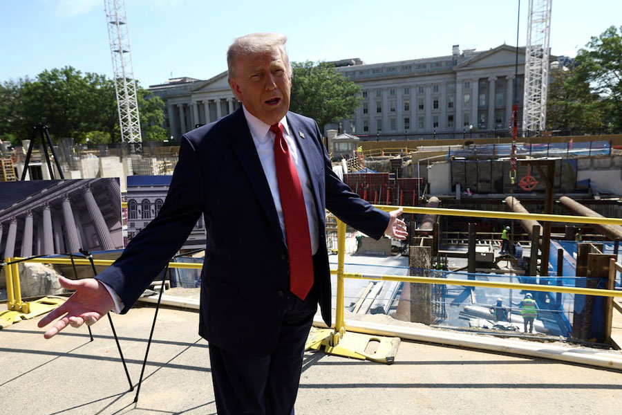 US President Donald Trump gestures at the site of ongoing construction of the planned White House ballroom in Washington, DC, US, May 19, 2026.