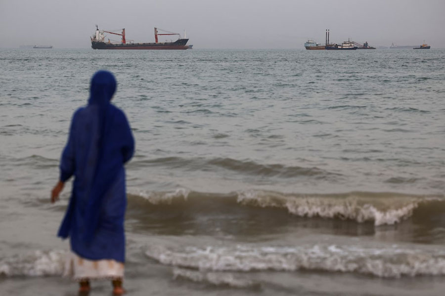 Vessels in the Strait of Hormuz are visible near the beach of Bandar Abbas, Iran, May 22, 2026.