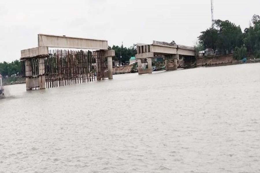 Photo shows the collapsed under-construction Shah Arefin-Adwait Maitree Bridge on the Jadukata River in Tahirpur upazila of Sunamganj district. — FE Photo