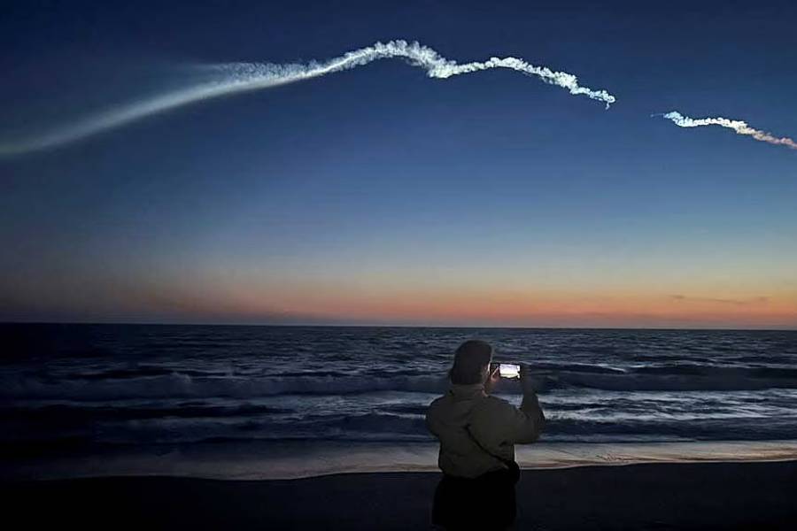 The Falcon 9 carrying Starlink satellites streaks across the sky in California.