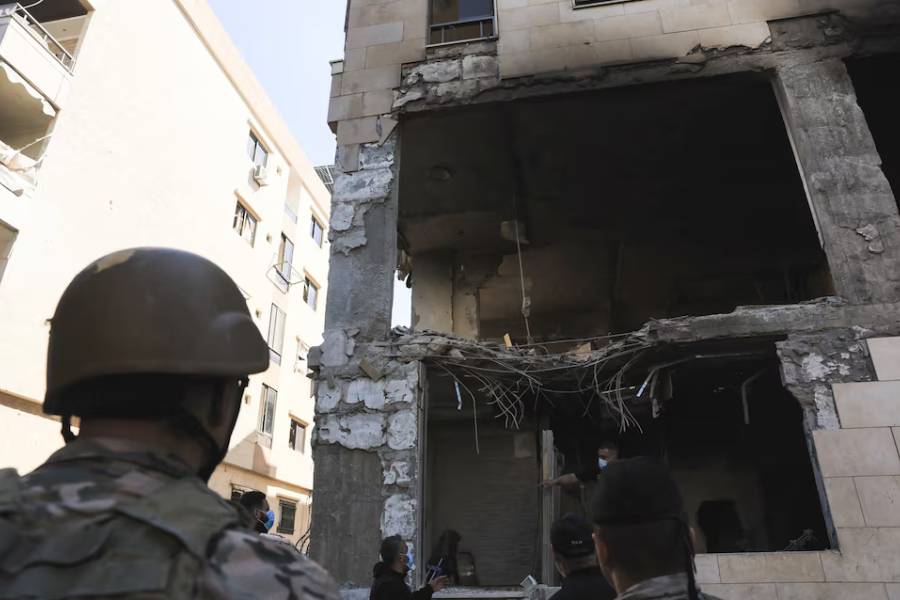 People inspect the damage at the site of an Israeli strike on Beirut's southern suburbs, Lebanon, May 28, 2026.