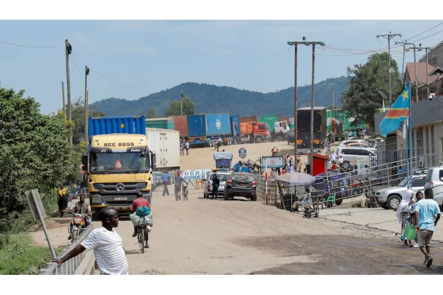 People walk , after Uganda closed its borders with the Democratic Republic of Congo, as authorities intensify efforts to contain a new Ebola outbreak caused by the Bundibugyo virus strain, at the Mpondwe border post, in Kasese district, Uganda, May 28, 2026.