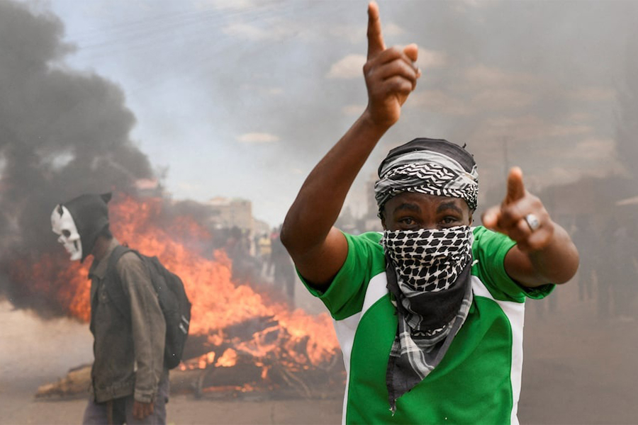 A demonstrator gestures as they erect a barricade during a protest against a US-backed Ebola quarantine plan and the establishment of a 50-bed facility at a Kenyan air force base that was intended to host Americans exposed to Ebola, in Nanyuki town, in Laikipia County, Kenya on June 1, 2026. — Reuters photo