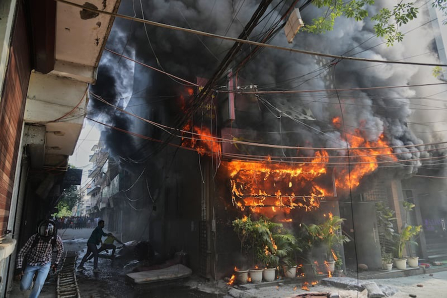 Local people attempt to douse a fire at a hotel in New Delhi, India, on Wednesday, June 3, 2026 — AP photo