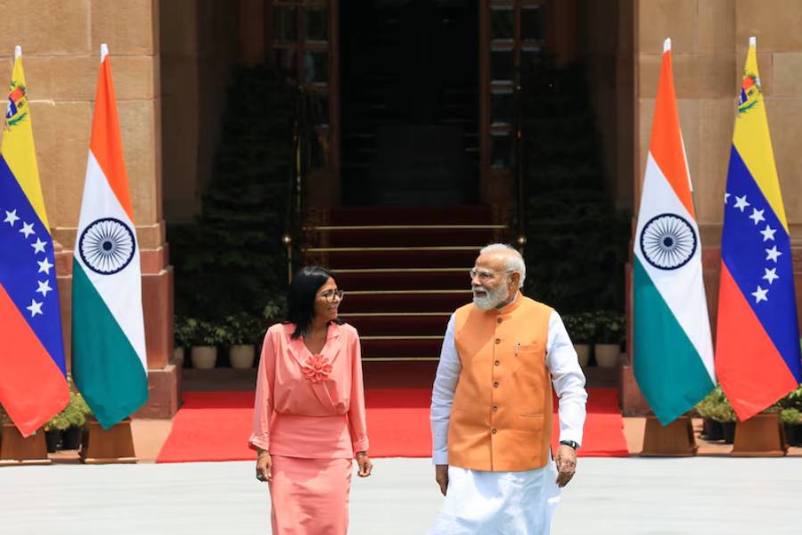 India's Prime Minister Narendra Modi walks with Venezuela's interim President Delcy Rodriguez before their meeting at the Hyderabad House in New Delhi, India, June 4, 2026.