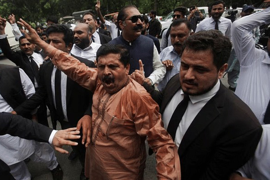 Lawyers gather to protest following the arrest of Pakistan's former Prime Minister Imran Khan, outside his residence in Lahore, Pakistan Aug 5, 2023. REUTERS