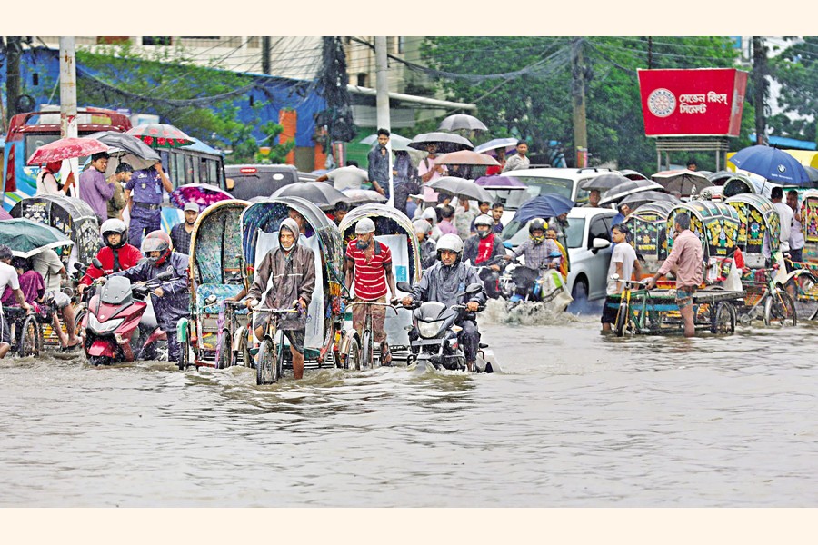 ROAD TURNS INTO RIVER: Chattogram city experienced heavy rainfall on Sunday, the third consecutive day of downpour, which led to inundation in most areas of the port city. — Focus Bangla