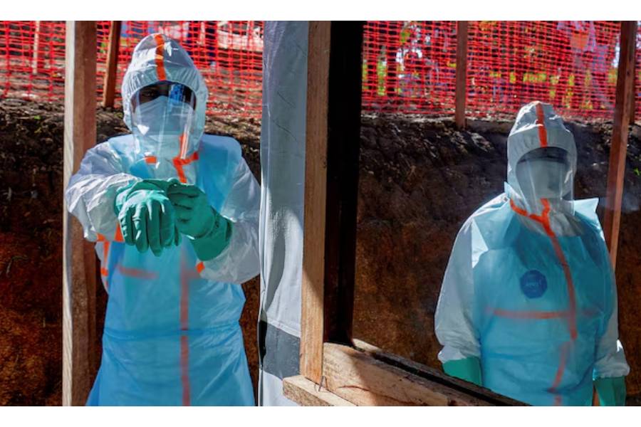 Health workers get dressed in personal protective equipment (PPE) at the Evangelical Medical Center, one of the facilities at the forefront of the response to the Ebola outbreak, as agencies intensify efforts to contain a new Ebola outbreak caused by the Bundibugyo virus strain, in Bunia, Ituri province, Democratic Republic of Congo, May 31, 2026.