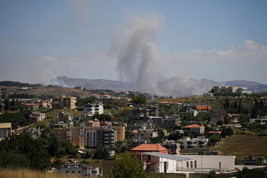 Smoke billows from southern Lebanon following an Israeli strike, as seen from Kfartibnit, Lebanon, June 19, 2026.