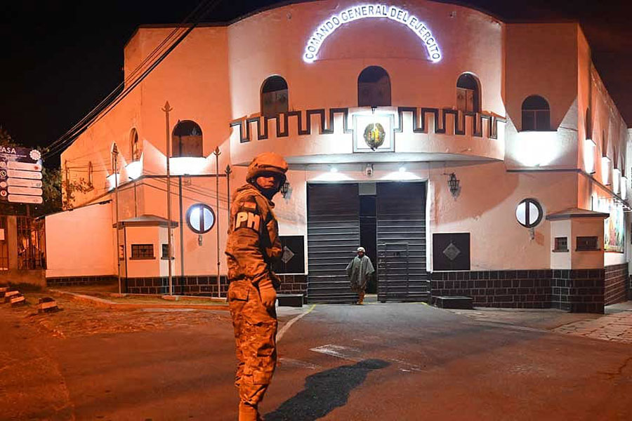 A soldier stands outside the Estado Mayor headquarters, after Bolivian President Rodrigo Paz declared a nationwide state of emergency following weeks of violence and blockades, in La Paz, Bolivia, Jun 20, 2026.