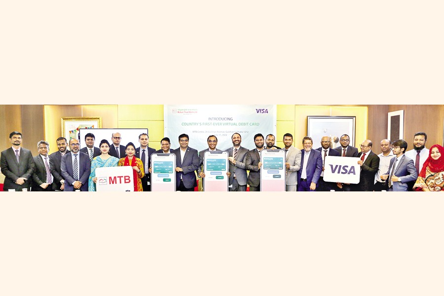 Mutual Trust Bank Limited (MTB) launched the country's first-ever virtual debit card, a groundbreaking digital solution under Visa Network. Seamlessly blending innovation, security and convenience, this cutting-edge offering is set to revolutionise day-to-day transactions for users nationwide, according to a statement. MTB's virtual debit card promises a hassle-free and secure banking experience, catering to the modern-day needs of customers. With the option to make ATM transactions through cash by code, customers can access their funds anytime using MTB's widespread ATM network. This virtual card can also be used at merchant points across the country through a QR code. The card is also equipped with an e-commerce transaction facility, empowering cardholders to confidently and easily navigate the online shopping landscape. Applying for the card is quick and easy through the MTB Smart Banking app. Syed Mahbubur Rahman, managing director & CEO of MTB, has recently launched the service at a ceremony held at MTB Centre, the bank's corporate head office, in the capital. Among others from MTB, Md Shafquat Hossain, head of retail banking, Abdul Mannan, head of branch banking division, Md Abu Bokar Siddik, head of cards, Khalid Hossin, head of digital banking division, and Azam Khan, head of communications department, were present at the ceremony. From Visa, Soumya Basu, country manager of Visa Bangladesh, Nepal, and Bhutan, Ashish Chakraborty, director, Business Development-South Asia- Visa, and Arifur Rahman, director, Merchant Sales & Acquiring, South Asia - Visa, were also present.