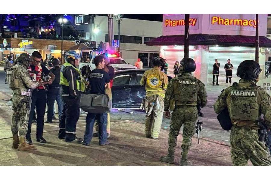 Security personnel and emergency responders stand at the site where a car rammed through a crowd of Mexico football fans, in Cabo San Lucas, Mexico, in this handout released on Jun 25, 2026.