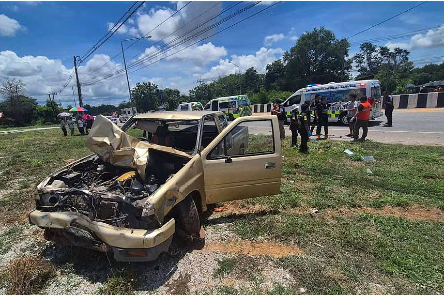 Emergency medical personnel work next to a damaged vehicle that was crashed by an 11-year-old boy into a group of Buddhist monks along the roadside in Mukdahan, Thailand, Jul 2, 2026.