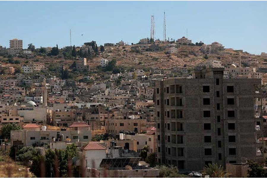 A view of Jenin refugee camp, as Israeli heavy machinery operates on Palestinian land in the Israeli-occupied West Bank, June 16, 2026. Residents say Israeli authorities issued orders to confiscate the land for military purposes in the area where the machinery was deployed.