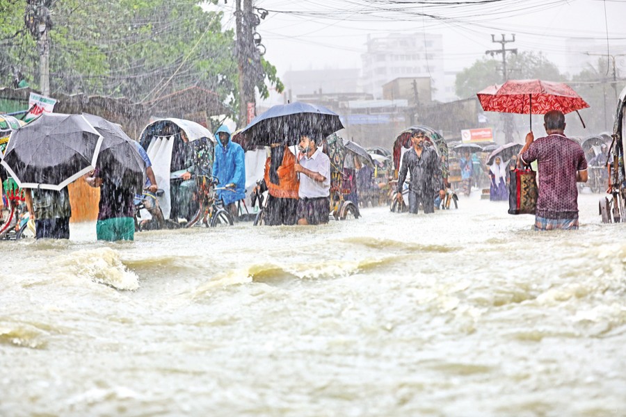 Torrential rainfall caused severe waterlogging in the low-lying areas of Chattogram on Tuesday. The photo was taken from the Chawkbazar area of the city. — Focus Bangla