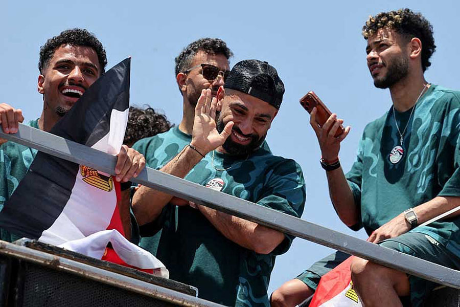 Egypt's Mohamed Salah waves as Egypt's national team is welcomed by fans at El Alamein International Airport upon its return from the 2026 FIFA World Cup, ahead of an official reception by President Abdel Fattah al-Sisi, in El Dabaa, Egypt, Jul 10, 2026.