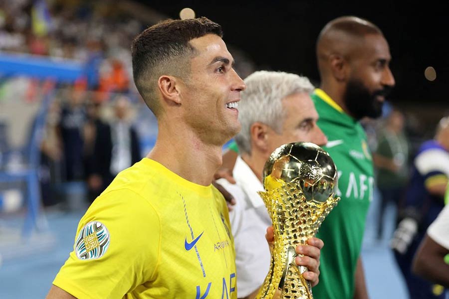 Al Nassr's Cristiano Ronaldo celebrating with the trophy after winning the Arab Club Champions Cup final at King Fahd Stadium in Taif of Saudi Arabia on Saturday –Reuters photo