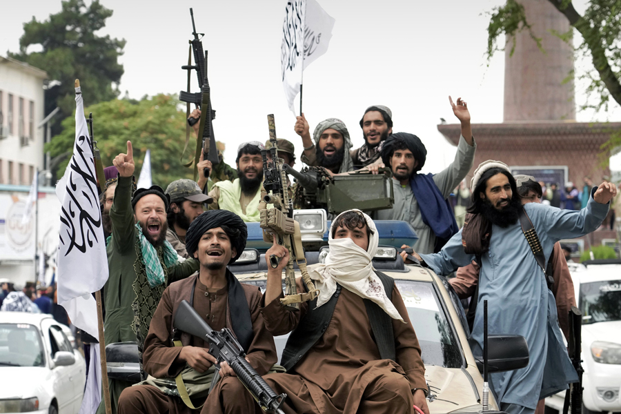 Taliban fighters celebrate the first-year anniversary of their takeover in front of the former US Embassy in Kabul on August 14, 2022 —AP Photo