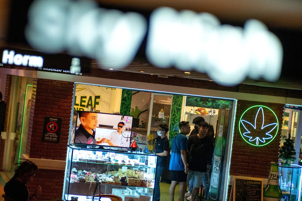 Tourists shop cannabis at a cannabis store, at Khaosan Road, one of the favourite tourist spots in Bangkok, Thailand, January 6, 2023. REUTERS/Athit Perawongmetha/File Photo