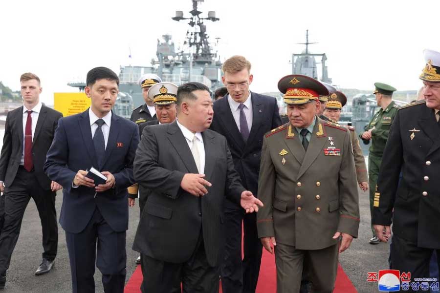 North Korean leader Kim Jong Un walking with Russia's Defence Minister Sergei Shoigu during a visit to Russia on Saturday –Reuters