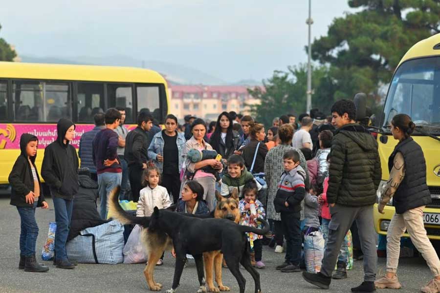 Residents gathering next to buses in central Stepanakert before leaving Nagorno-Karabakh, a region inhabited by ethnic Armenians, on Monday –Reuters photo