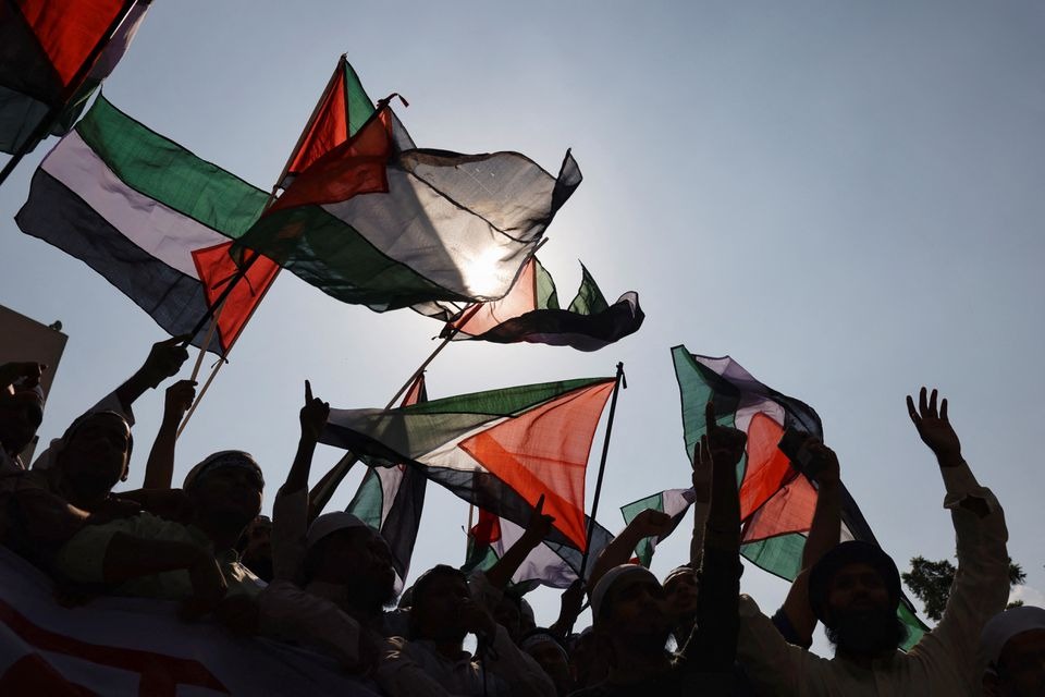 Bangladeshi Muslim activists wave Palestinian flags as they protest against Israel's actions against Palestinians after Friday prayer at the Baitul Mukarram National Mosque in Dhaka, Bangladesh on October 13, 2023 — Reuters photo