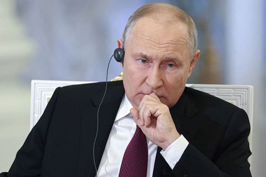 Russian President Vladimir Putin attends an interview with China Media Group anchor Wang Guan at the Kremlin in Moscow, Russia, in this image released October 16, 2023.