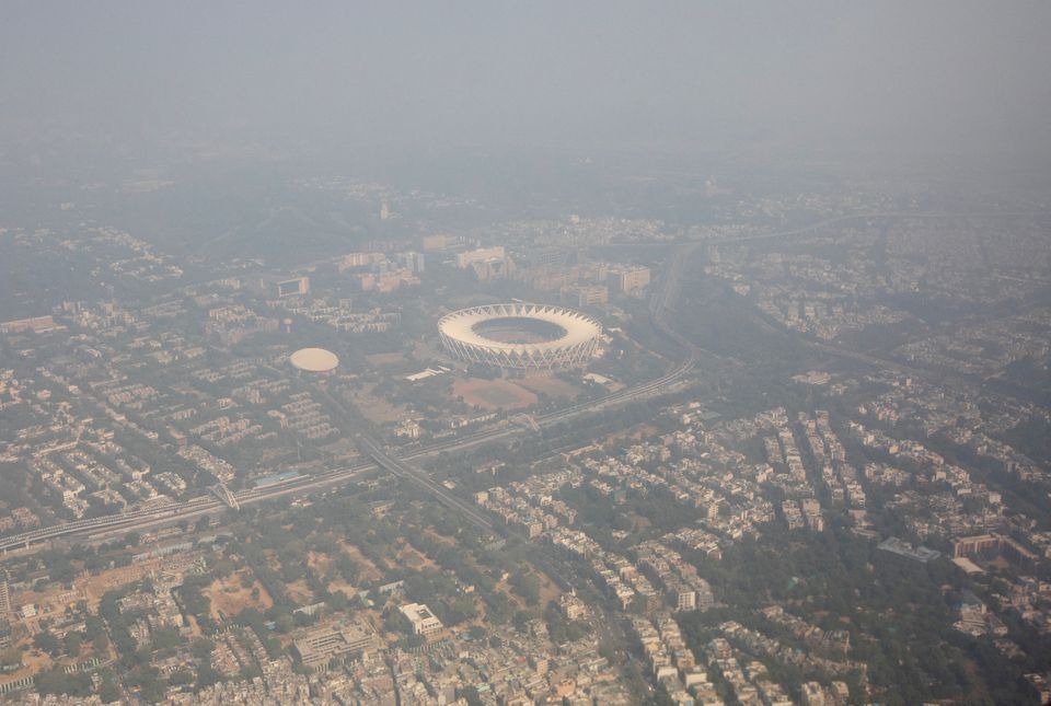 An aerial view shows residential buildings and a stadium shrouded in smog in New Delhi, India on October 27, 2023 — Reuters photo