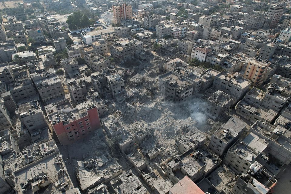 Palestinians gather at the site of Israeli strikes on houses in Bureij in the central Gaza Strip on November 2, 2023 — Reuters photo