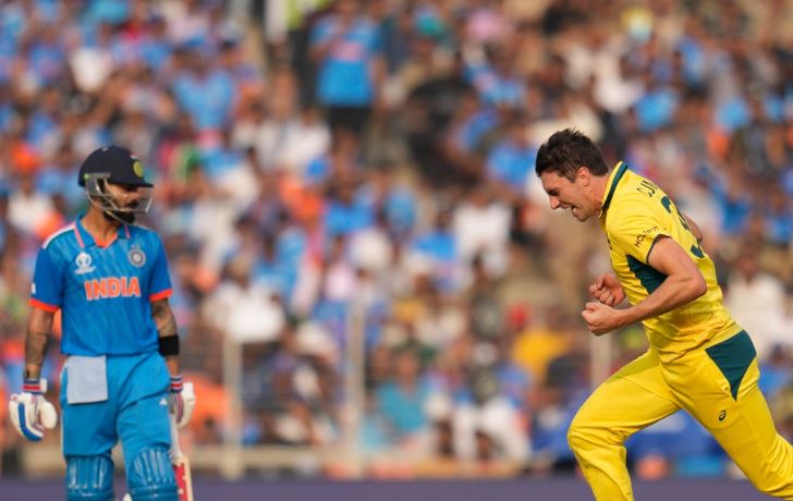 Australia's captain Pat Cummins celebrates the wicket of India's Virat Kohli,left, during the ICC Men's Cricket World Cup final match between India and Australia in Ahmedabad, India, Sunday, Nov.19, 2023. (AP Photo/Aijaz Rahi)