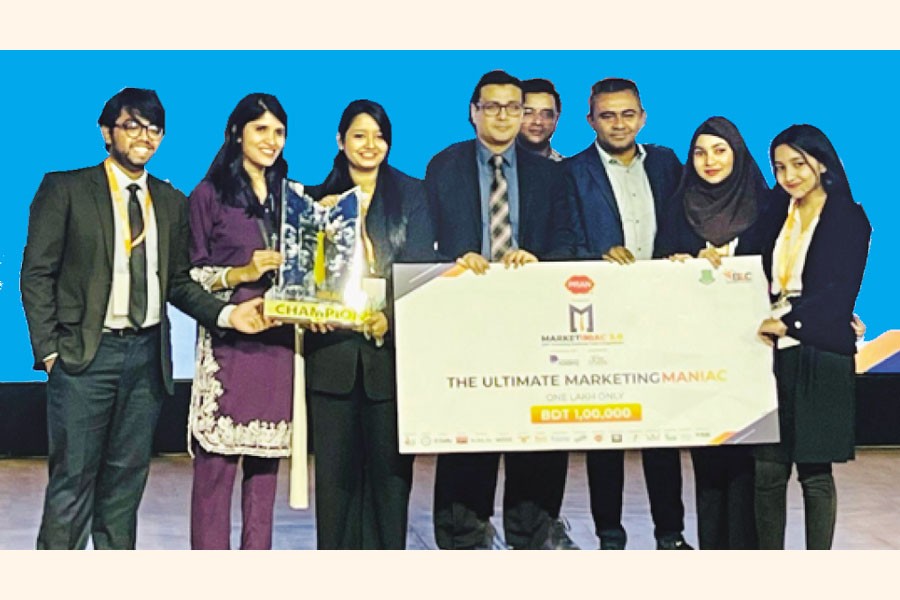 Winning team members and judges pose after the competition