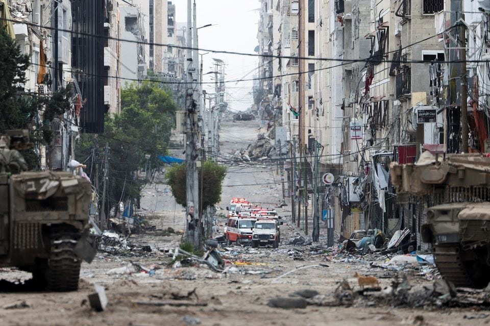 A convoy of Palestinian ambulances waits on a road leading to Al Shifa Hospital in Gaza City, amid the ongoing ground operation of the Israeli army against Palestinian Islamist group Hamas, in the northern Gaza Strip on November 22, 2023 — Reuters photo