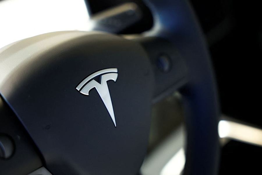 Tesla logo is seen on the steering wheel of an electric vehicle at a dealership in Durango, northern Spain on October 30, 2023 — Reuters/Files